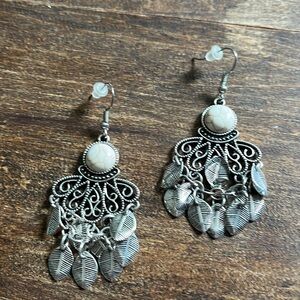 Silver earrings with a cream marbled bead